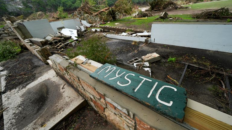 A Camp Mystic sign is seen near the entrance. Pic: AP