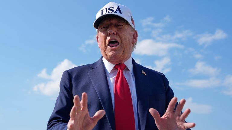 President Donald Trump talks to reporters before boarding Air Force One, Thursday, July 3, 2025, at Joint Base Andrews, Md. (AP Photo/Alex Brandon)